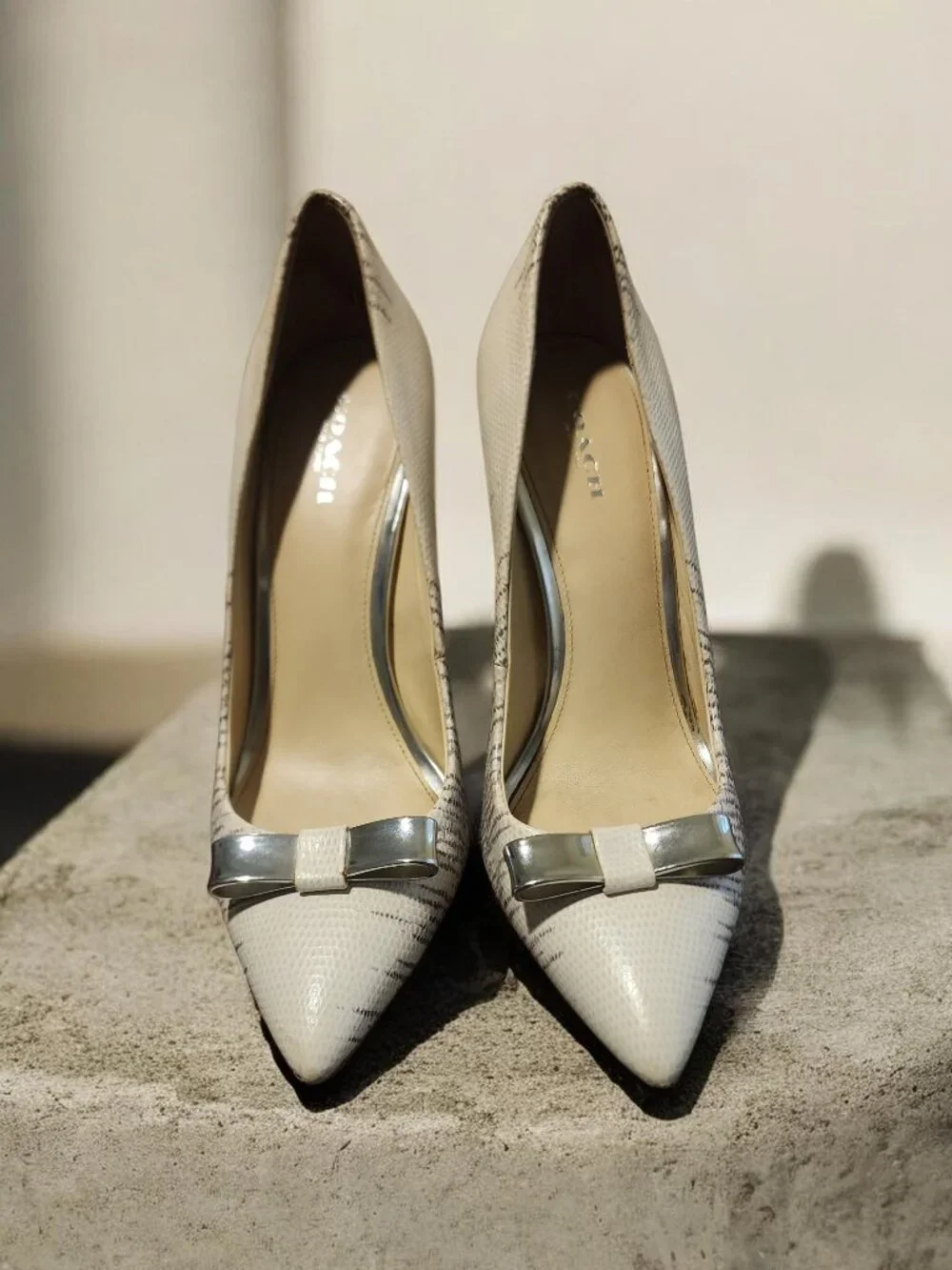 Coach White Pointed Toe Heels with Silver Bow Accent